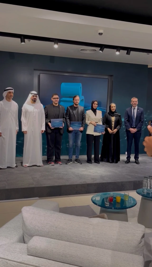 Igor receiving an AI sofa design award at Mall of the Emirates