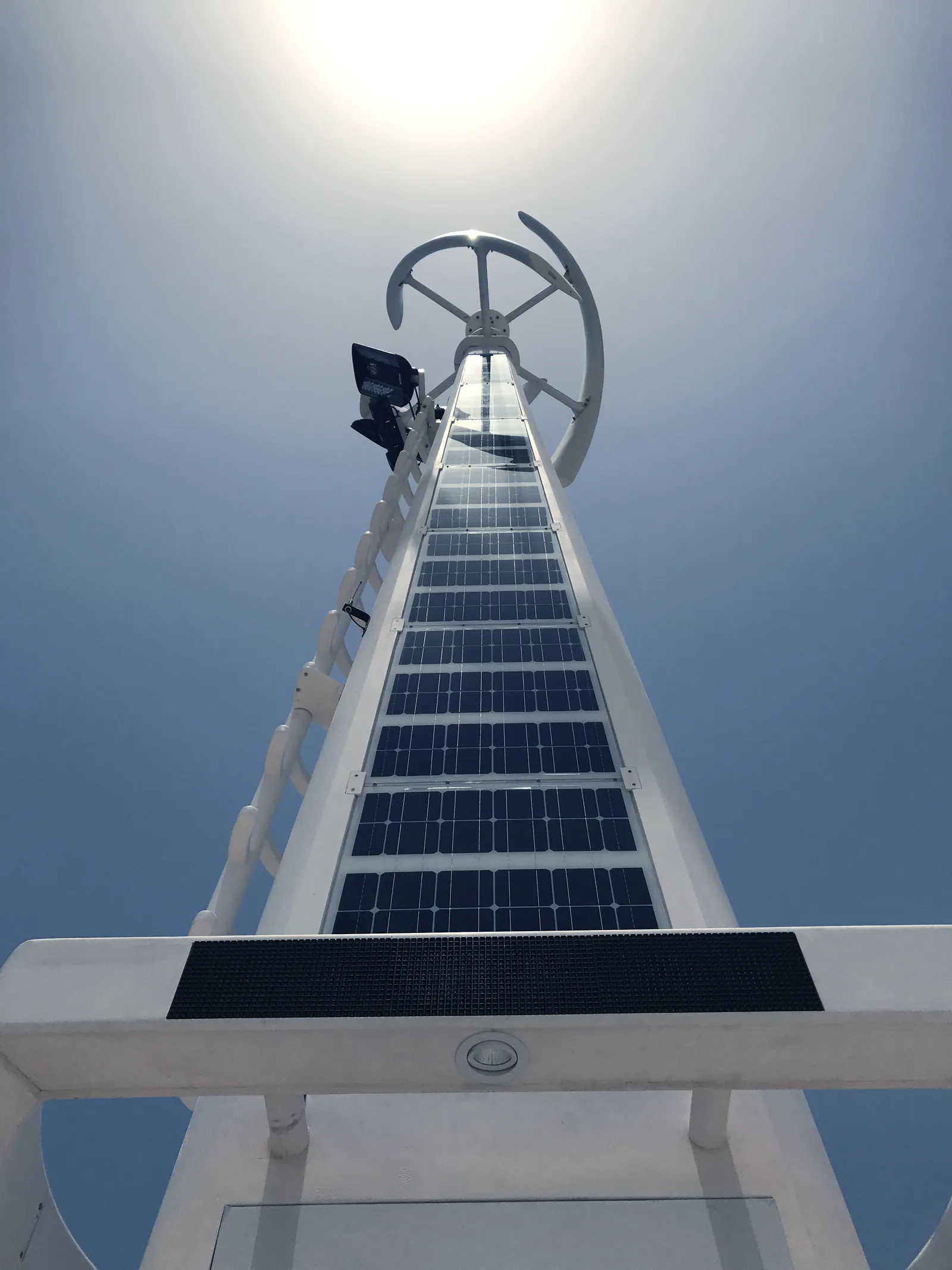Looking up the pole: solar cladding, lighting and turbine